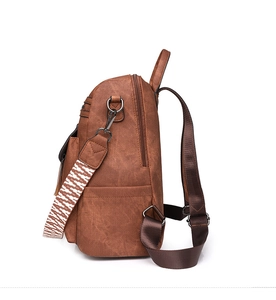 Side view of brown PU leather backpack featuring textured wide straps and gunmetal zippers