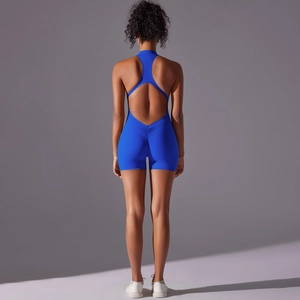 Detail of royal blue backless yoga romper featuring ruched butt lifting design and cut-out