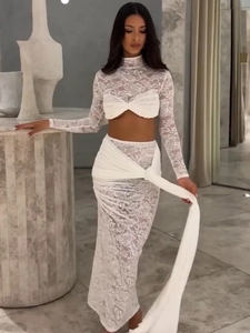 Elegant white lace two-piece set featuring long sleeve crop top and maxi skirt for women