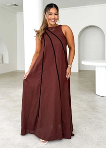 Detailed texture of dark brown sleeveless dress with vertical black stripes and cotton fabric