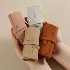 Organizador de joyas portátil de microfibra para anillos y relojes en cuatro colores