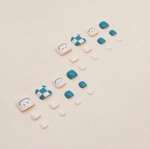 Blue and white checkerboard toe nail set with smiley faces and glossy solid finish