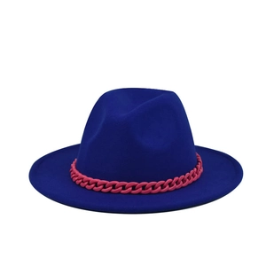 Close-up of royal blue wool fedora featuring a bold pink chain link decorative band