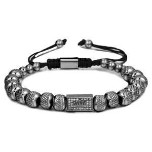 Detailed view of crown beaded bracelet with cubic zirconia inlay and adjustable woven cord