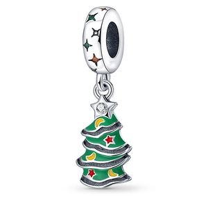 Detail of Christmas tree charm with green enamel, star patterns, and white zircon inlay