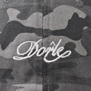 Vintage washed camouflage baseball cap with white cursive embroidery detail