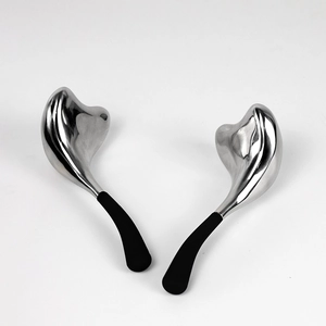 Pair of stainless steel mermaid ice globes with ergonomic black handles for facial massage