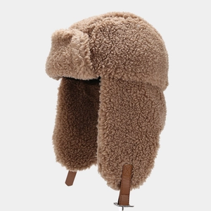 Winter faux shearling trapper hat in dark camel with adjustable leather strap