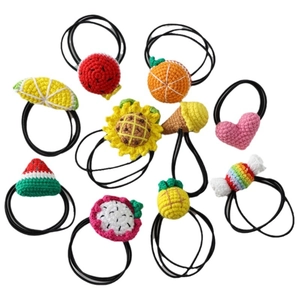 Colorful handmade crochet fruit and dessert hair ties set for girls on white background
