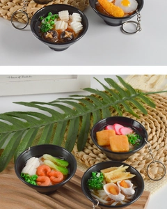 Detailed close-up of various miniature Japanese udon and ramen bowl keychain models