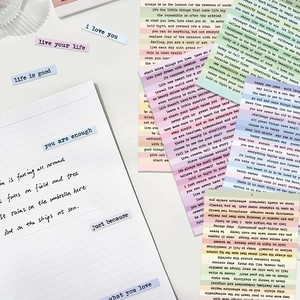 Detailed view of colorful retro Small Talk stickers with inspirational quotes for DIY journals