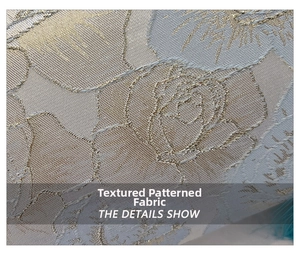 Close-up of premium metallic jacquard fabric with rose pattern on shell bag