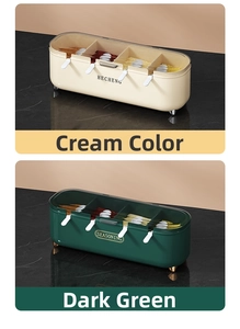 Close-up of cream and green four-compartment seasoning boxes with spoons and clear lids