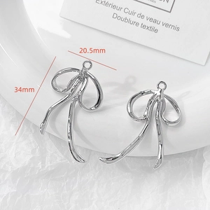 Polished silver bow-shaped jewelry pendants with size measurements 34mm by 20.5mm