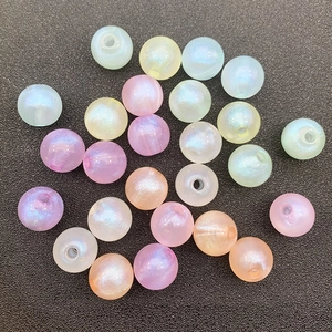 Macro shot of macaron colored luminous craft beads with aurora pearlescent finish