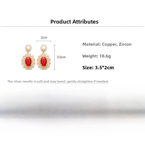 Detailed view of red oval zircon earrings with dimensions 3.5x2cm and weight 10.6g