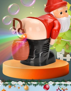 Funny Santa bubble machine blowing bubbles from backside with Christmas tree background