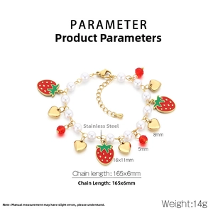 Detail of strawberry charm bracelet with white pearls and heart pendant on stainless steel