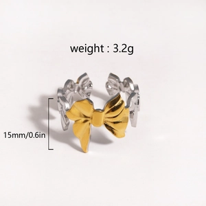 Detail view of a two-tone bow-shaped adjustable ring with size and weight annotations