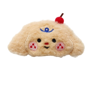 Cute plush puppy hair clip with cherry decor and embroidered face on white background