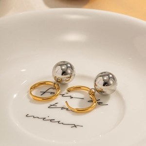 Minimalist two-tone stainless steel hoop earrings with gold ring and silver ball pendant