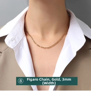 Close-up of a 3mm golden Figaro chain necklace worn by a model in formal attire