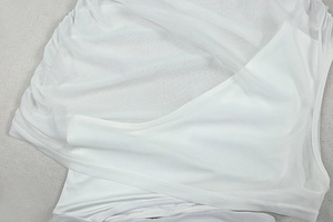 Detail of white mesh fabric texture with opaque inner lining for women dress