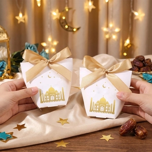 Close-up of Eid Moon Festival gift box with gold foil mosque and ribbon details