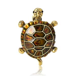 Elegant gold-tone tortoise brooch with amber enamel shell and intricate grid patterns