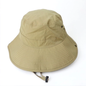 Close-up of khaki wide-brim sun hat featuring metal vents and adjustable drawstring