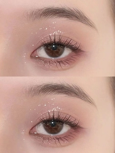 Macro shot of pink glitter liquid eyeshadow and long lashes showing shimmery finish