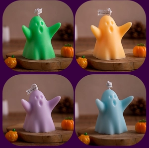 Ghost-shaped scented candles in green, orange, purple and blue for Halloween decor