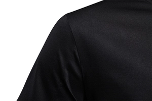 Detailed close-up of the shoulder and neckline on a black cotton short-sleeve t-shirt