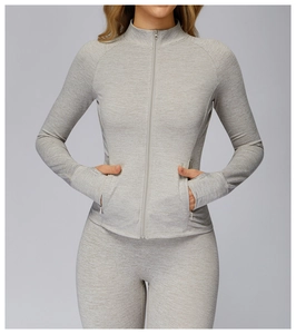 Close-up of heather grey athletic jacket with invisible zipper pockets and thumbhole cuffs