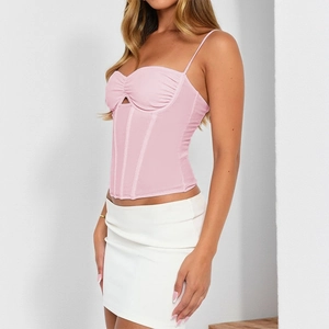 Close-up of pink corset top featuring structural boning and slim fit design