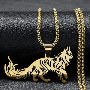 Macro shot of a golden hollowed-out fox pendant on a box chain jewelry necklace