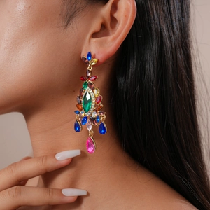 Close-up of Bohemian court style teardrop earrings with colorful crystals on a model