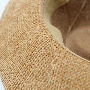 Detail of premium brown chenille weave texture and reinforced inner sweatband of jazz hat