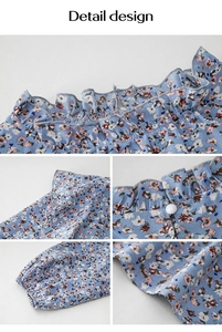 Dettagli della camicetta a fiori con scollo a balze e polsini elasticizzati