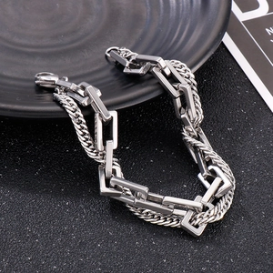 Minimalist double-layer silver Cuban chain stainless steel bracelet on a black tray