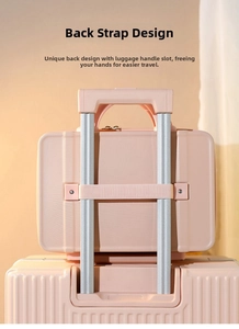 Pink hardshell makeup case featuring a back elastic strap for suitcase handle attachment
