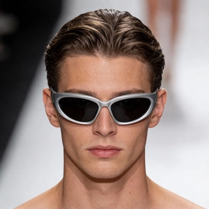 Y2K futuristic silver wrap-around sunglasses with sleek cat-eye lenses for a modern look