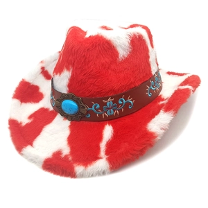 Detail of red and white cow print cowboy hat with turquoise and floral embroidery