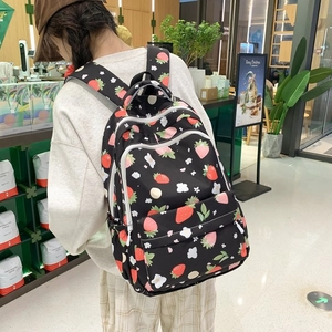 Black school backpack with cute strawberry print and white zippers for teenage girls