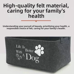 Detailed view of grey felt pet storage bin featuring durable texture and printed dog quotes