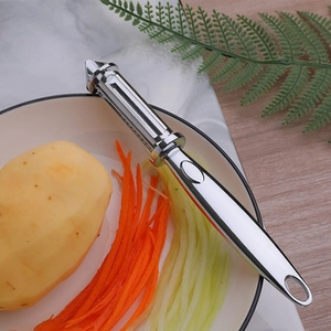 Close-up of a ergonomic stainless steel vegetable peeler with a polished silver finish