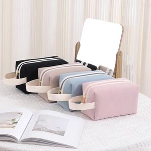 Corduroy waffle makeup bags in black, beige, blue and pink with stylish carry handles