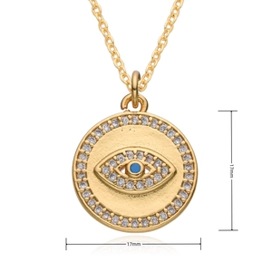 Close-up of 17mm gold Evil Eye pendant featuring micro-pave zircons and blue stone