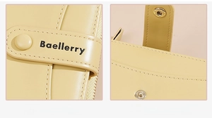 Detail of yellow Baellerry wallet showing hardware snap button and brand identity