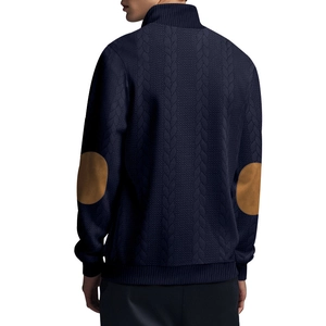 Detail view of navy jacquard knit cardigan featuring classic brown elbow patches on sleeves